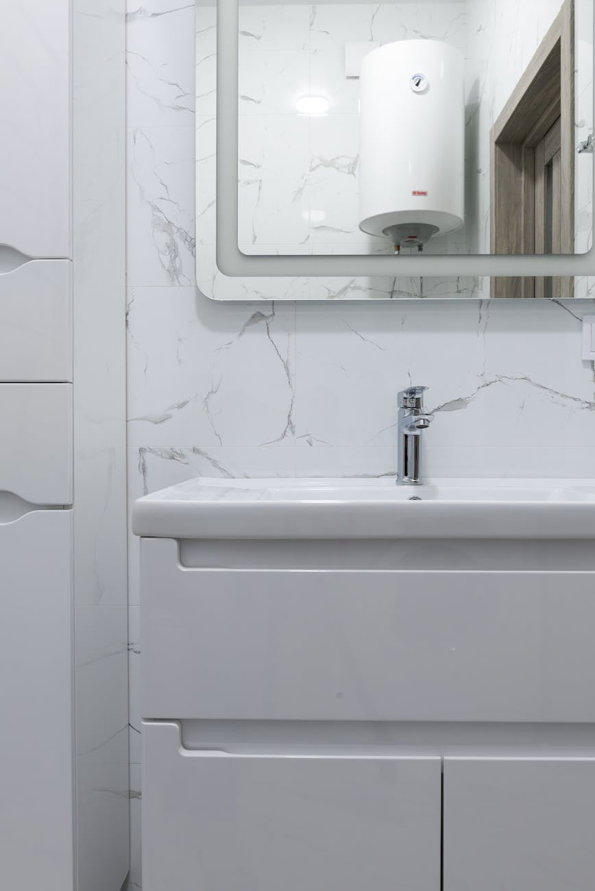 washstand under mirror in contemporary bathroom at home